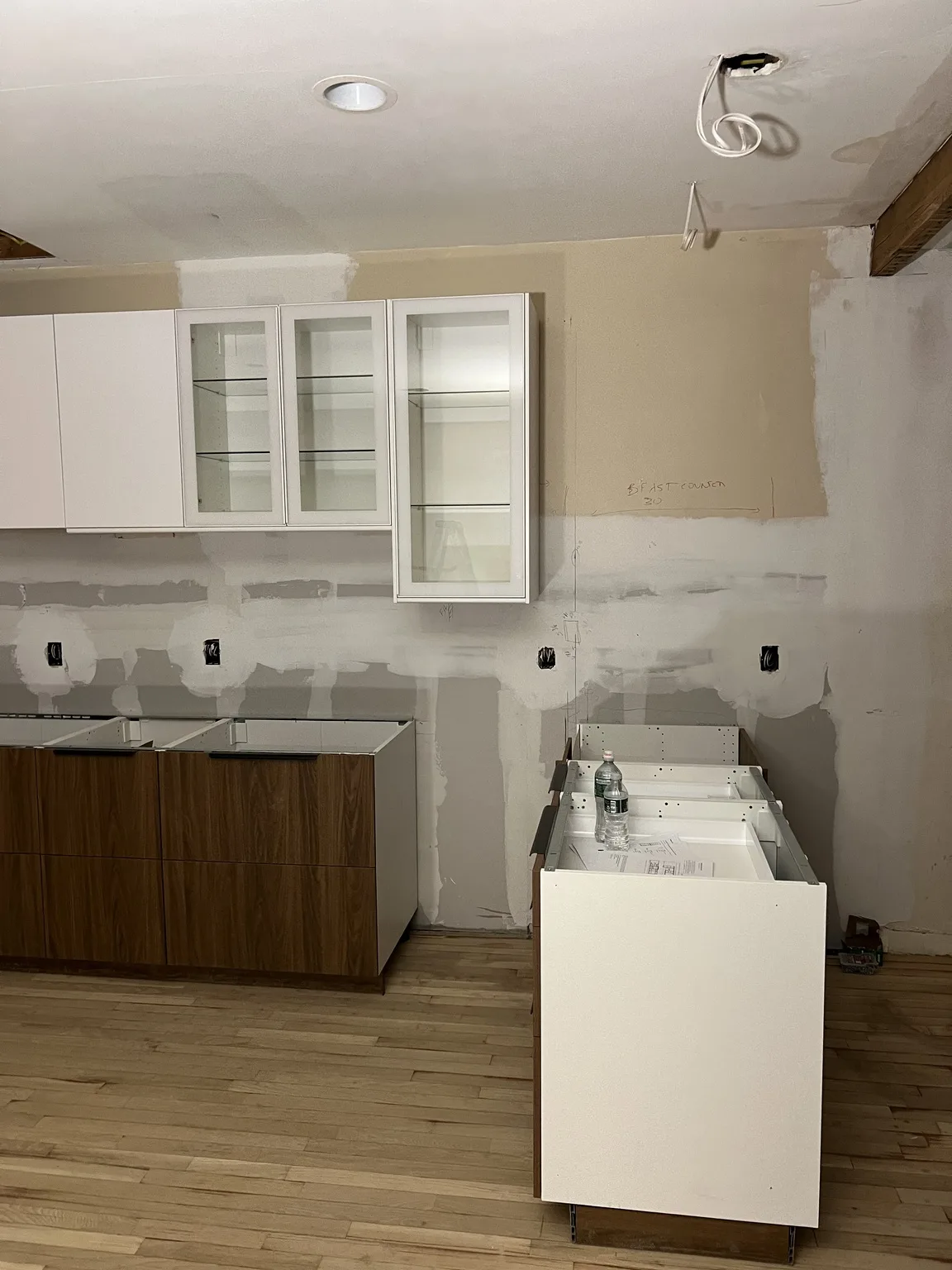IKEA kitchen installation near Midtown, NY — White Cabinets with Glass Doors