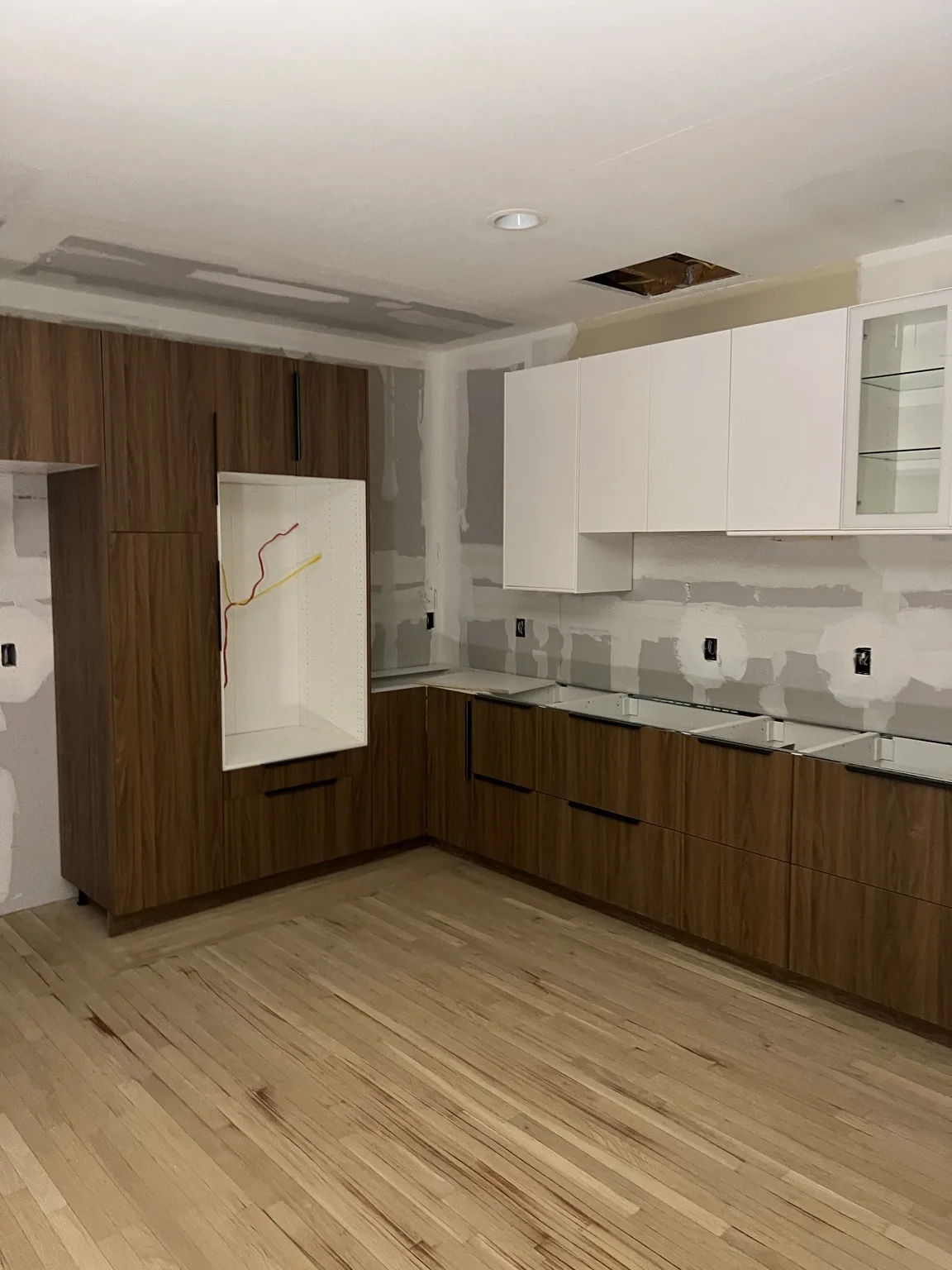 IKEA kitchen installation near Hell's Kitchen, NY — White Cabinets with Glass Doors