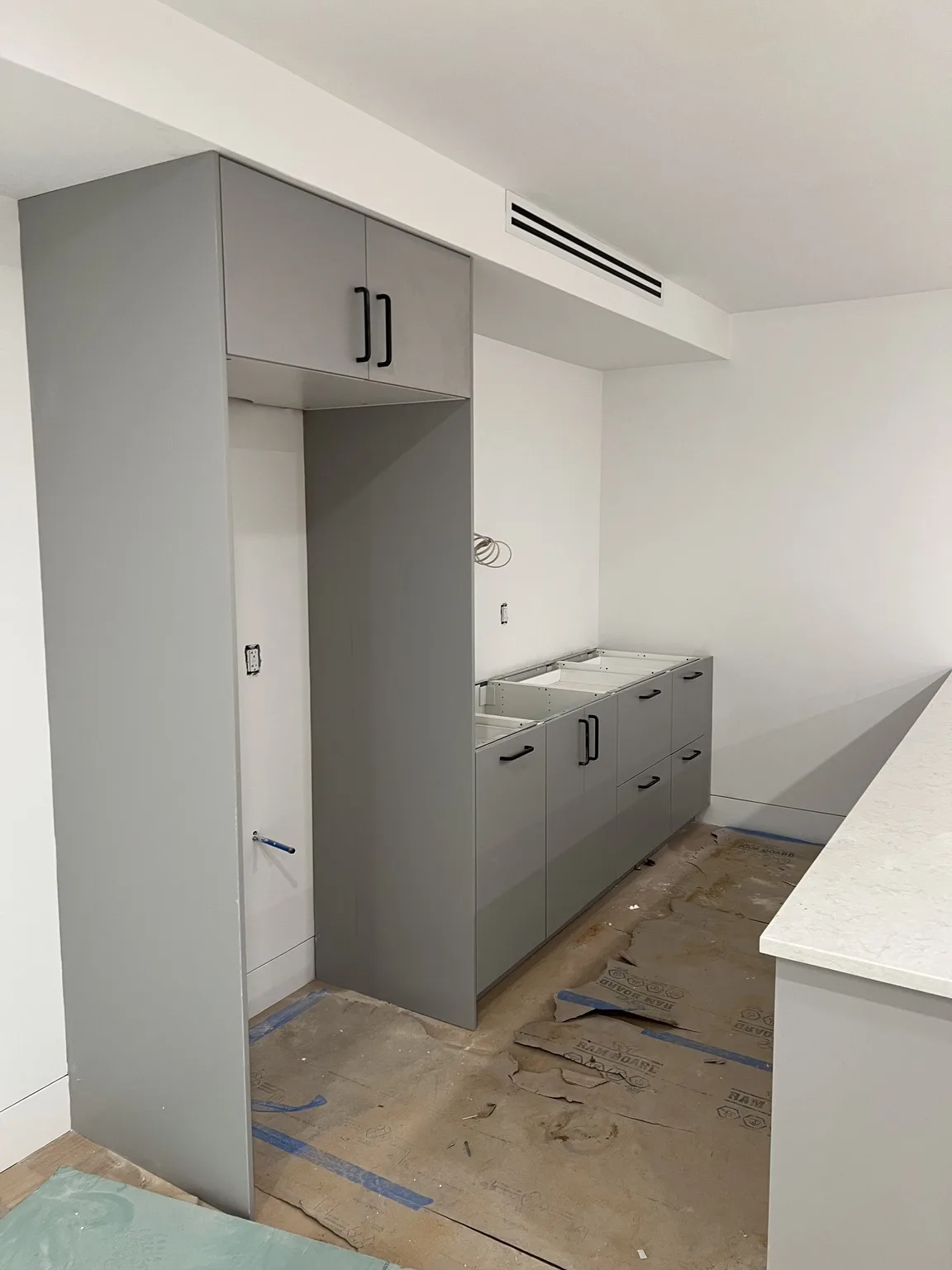 IKEA kitchen installation near Harlem, NY — Grey Base Cabinet Installation
