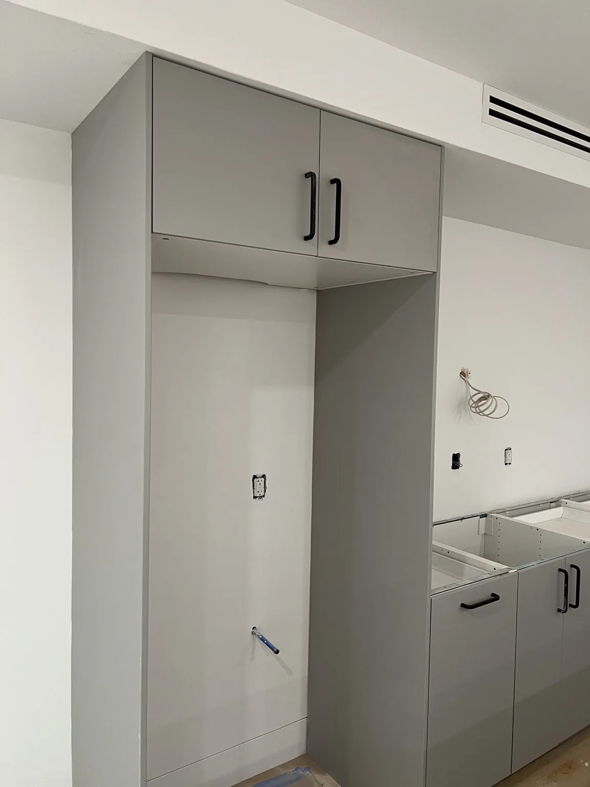 IKEA kitchen installation near DUMBO, NY — Grey Base Cabinet Installation